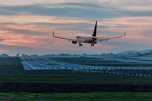 istock Airplane landing at  sunrise 2250871973