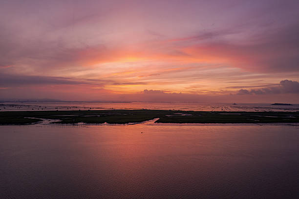 Mudflat and red dawn at sunrise