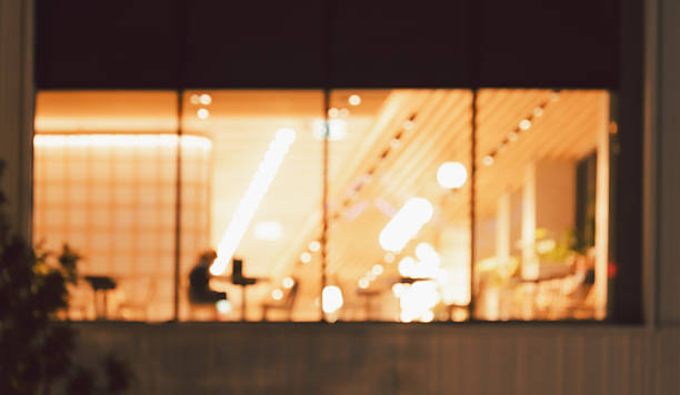 Defocused image of cafe or restaurant interior at night with gol