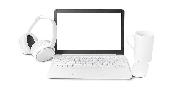 istock Modern laptop with headphones and mug on a clean workspace 2250874594