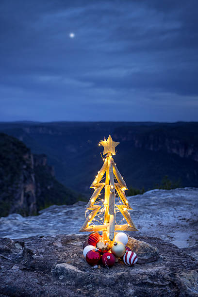 istock Rustic timber Chirstmas on a cliff in blue hour with twilight moon in sky 2250877301