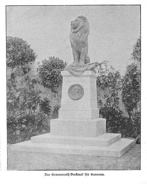 Monumental statue of a seated lion (Gravenreuth Monument), erected in memory of the German colonial officer Carl von Gravenreuth in Cameroon, depicted in a late 19th-century black and white photograph.