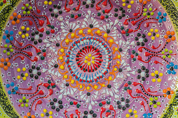 Background with Tunisian traditional ceramic in the plate form, painted with specific patterns.