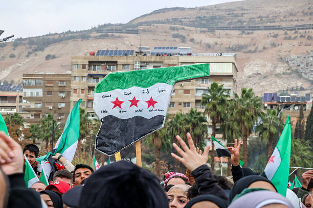 Damascus, Syria - December 08, 2025: Thousands of Syrians celebrate in the famous Umayyad Square in central Damascus, marking the first anniversary of the end of the war.