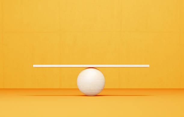 istock White Seesaw Before Yellow Background - Balance And Harmony Concept 2250885393