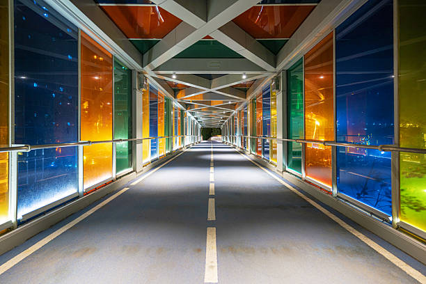 Brightly colored pedestrian overpass at night