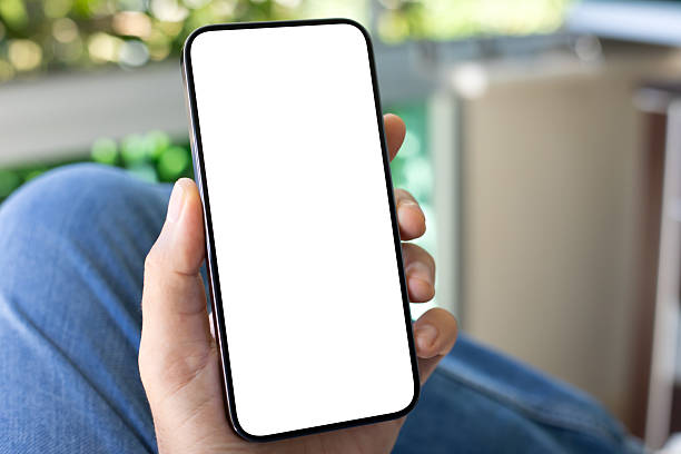 istock man hand hold phone with isolated screen background jeans cafe 2250886066