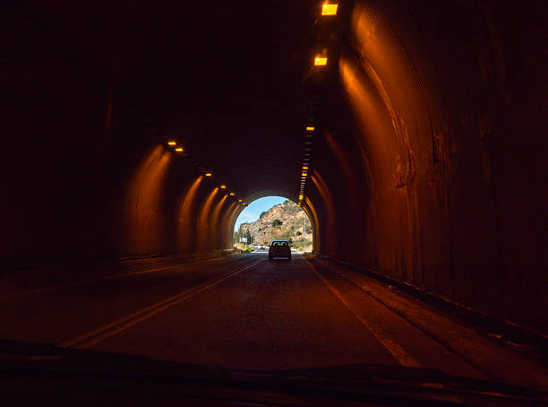 Illuminated car tunnel on a mountain road in Greece