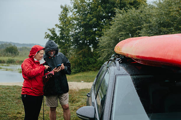 istock Senior couple checking map on phone before kayaking 2250892761