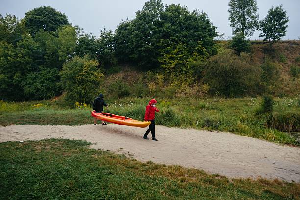 Canada British Columbia. Cranbrook region Lake. Lakit recreation park. Man fishing from a canoe