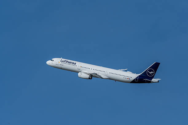 Barcelona, Spain - December 6, 2025:Lufthansa aircraft ascending into clean blue sky, representing flight, aviation, and international movement