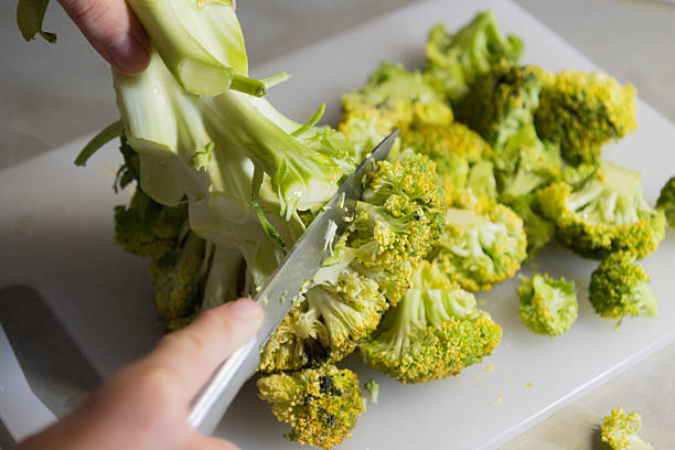 istock Slicing Fresh Broccoli into Florets – Healthy Kitchen Preparation 2250896930