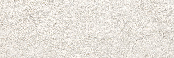 istock White new fluffy home carpet background. Closeup. Wide banner. Empty place for text. Top down view. 2250897941