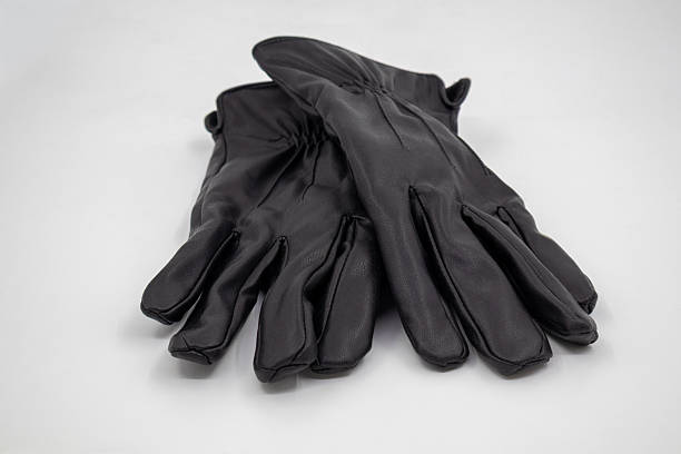 istock black leather gloves on white background 2250899916