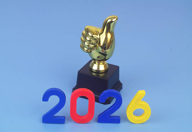 Best things in year 2026 concept. Gold thumbs up and numbers 2026 on blue background.