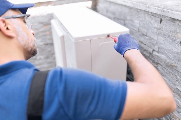 istock Repairman fixing AC outdoor unit. 2250907263