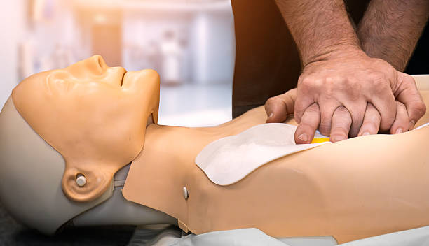 istock CPR and AED Defibrillator Emergency First Aid Resuscitation Training Class Dummy 2250909399