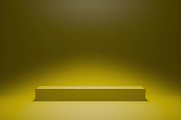 istock Empty minimal studio background with a yellow illuminated podium. Product scene 2250909586