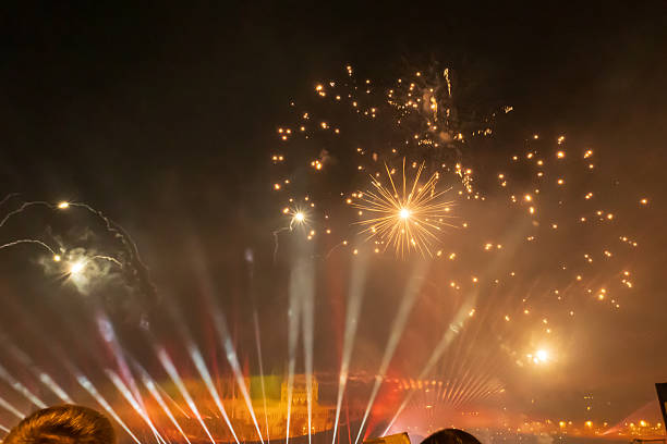 istock Golden fireworks display over city at night 2250910153