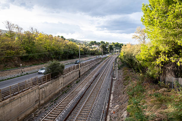 istock Parallel railway tracks and Strada Statale Adriatica in Pineto, Abruzzo, connecting transport and natural landscapes 2250912522