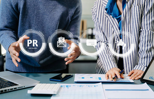 istock PR, Public relations concept. hands using laptop and tablet with public relations icon for communication advertising marketing strategy. with Ads and sales 2250914970