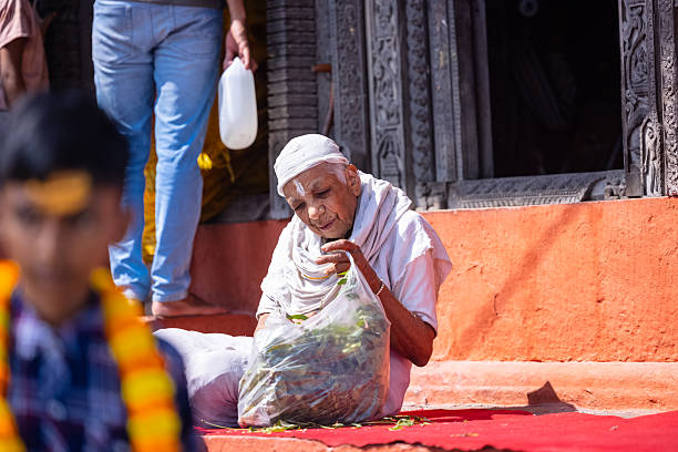 Varanasi, Uttar Pradesh, India - March 2024: Portrait on an identified woman sitting at the premises of home at varanasi.