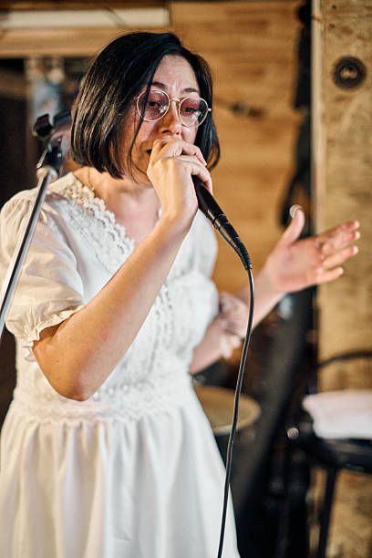 istock Female vocalist in cozy band rehearsal setting 2250917211