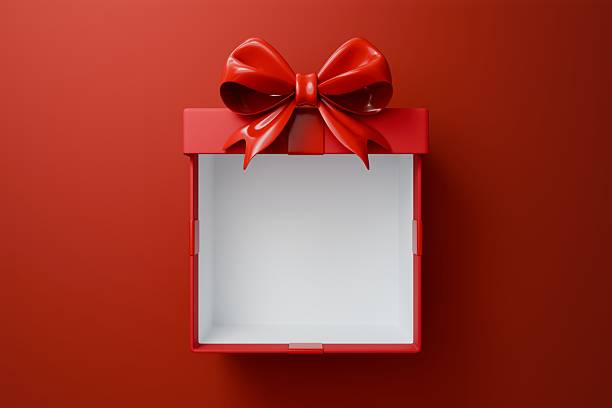 istock Front-facing view of an open red empty gift box with a prominent red  bow sitting on top, set against a monochromatic red background. 2250918419