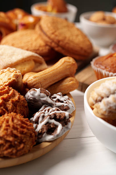 istock Delicious assortment of freshly baked cookies and pastries on a rustic table setting 2250920030