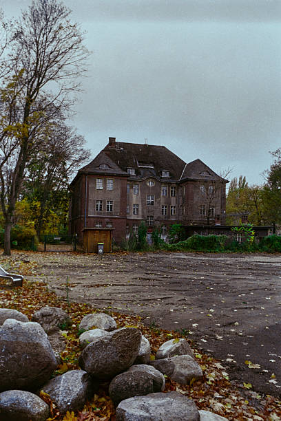 And abandoned public sports hall belonging to the city of Berlin, now empty and in decay.  Moabit, West Berlin, Germany.  Colour film photography. Scan from a negative.