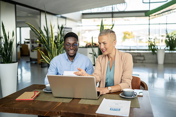 istock Business colleagues collaborating on laptop in modern office 2250920733