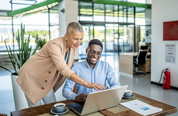 istock Business colleagues collaborating using laptop in office 2250920765