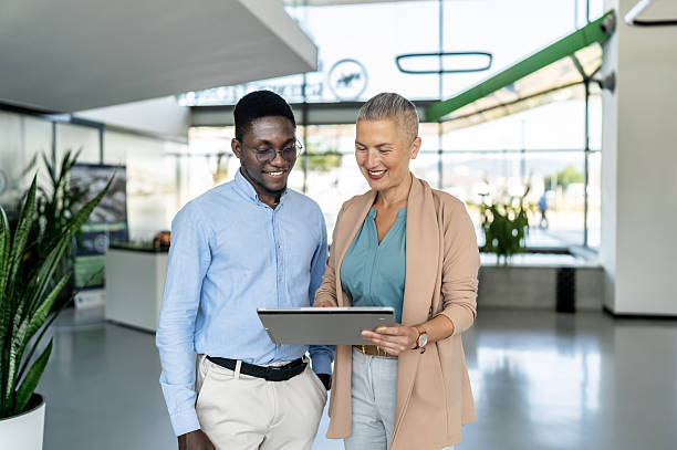 istock Business colleagues reviewing digital tablet content together 2250920853