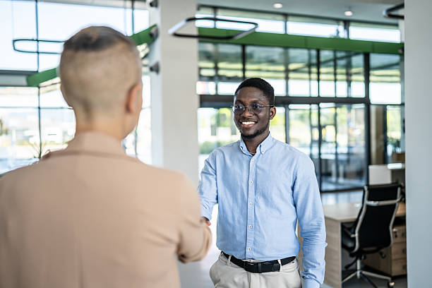 istock Business partners shaking hands in modern office 2250921008