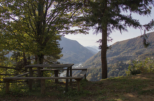 istock Picnic table overlooking mountains and forest valley in sunny weather 2250921920