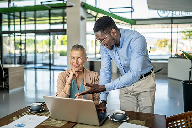 istock Diverse business colleagues collaborating on laptop in modern office 2250921982