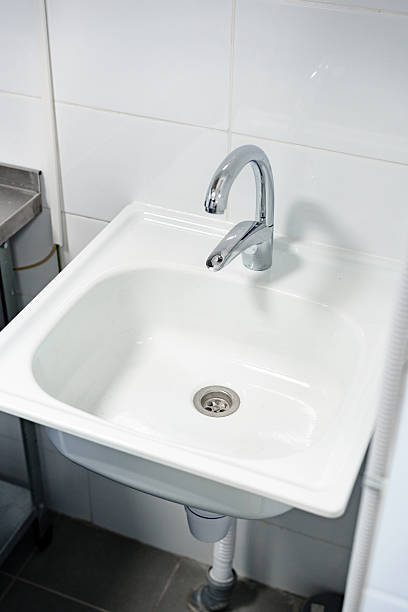 istock Modern white sink with a sleek faucet design in a clean bathroom environment 2250922552