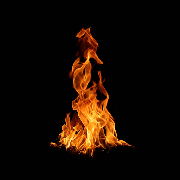 istock Bright orange fire flames isolated on black background, showing dynamic heat and energy movement. Perfect for design overlay, explosion effect, power, danger, and abstract background use. 2250923633