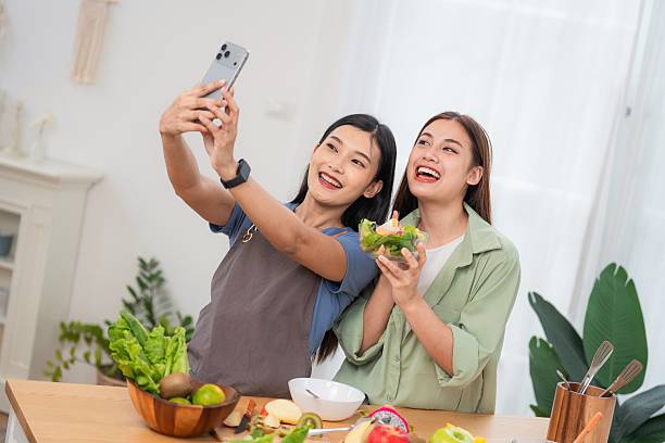 istock Two friends take a selfie while preparing a healthy meal in a kitchen during day time 2250924370