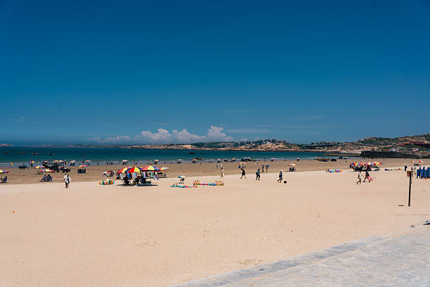 Promenade on the crowded Playa Sardinero in Santander, the capital of the autonomous community and historical region of Cantabria situated on the north coast of Spain.