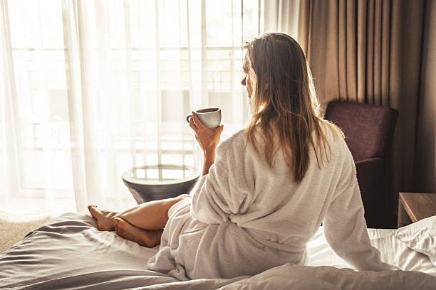 istock Young woman with bathrobe have a Breakfast in bed 2250927653
