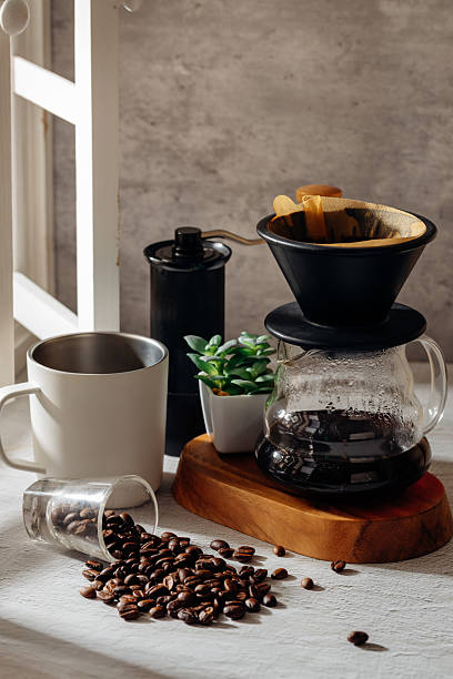 istock Coffee Brewing Setup with Grinder, Beans, and Fresh Plant Decoration 2250934213