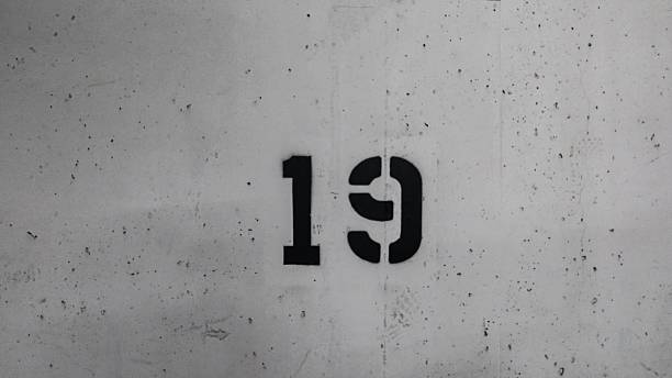 istock number 19 nineteen printed on the white wall 2250934517
