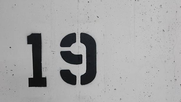 istock number 19 nineteen printed on the white wall 2250934550