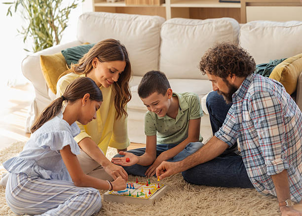 istock Family enjoys board game during weekend afternoon 2250939284
