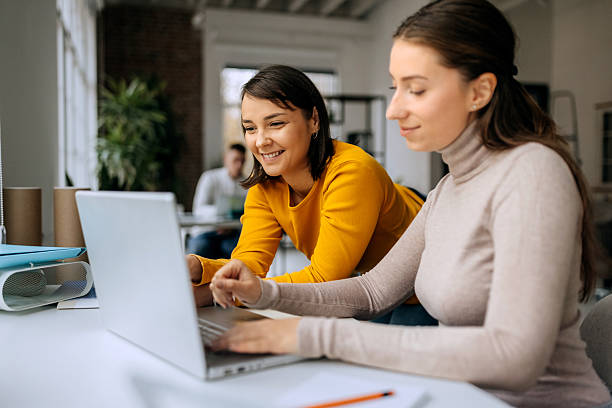 istock Two businesswomen working on laptop in office 2250940224