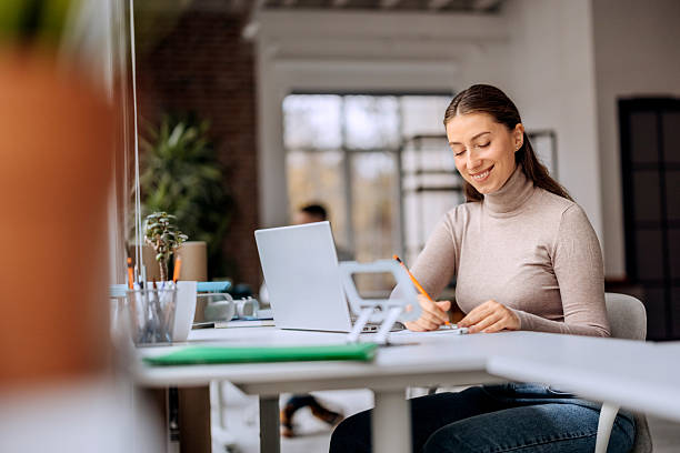 istock Businesswoman using laptop in office 2250940451