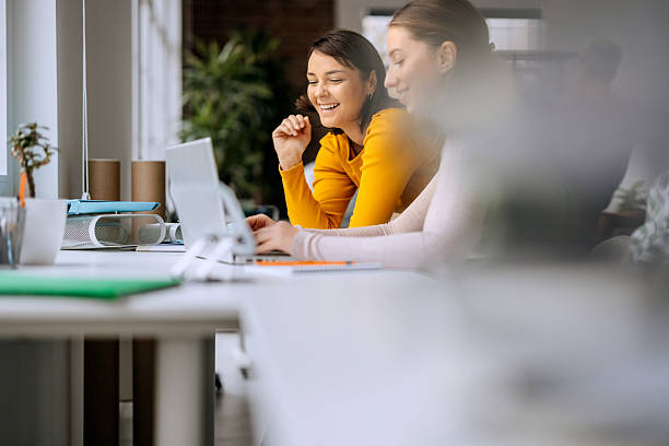istock Two businesswomen collaborating on laptop at office 2250940473