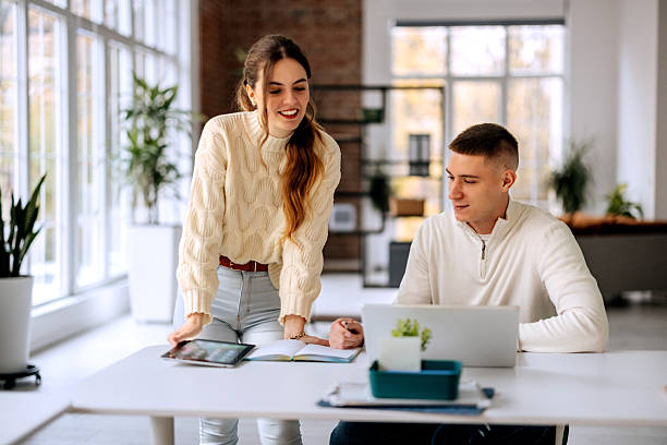 istock Young colleagues collaborating on a laptop at the office 2250940521