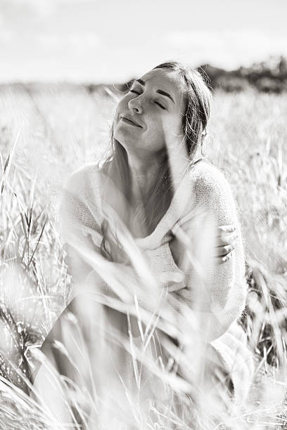 istock Woman enjoying rye field in soft natural light 2250942494